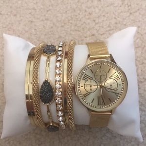 Set of gold bracelets & a watch